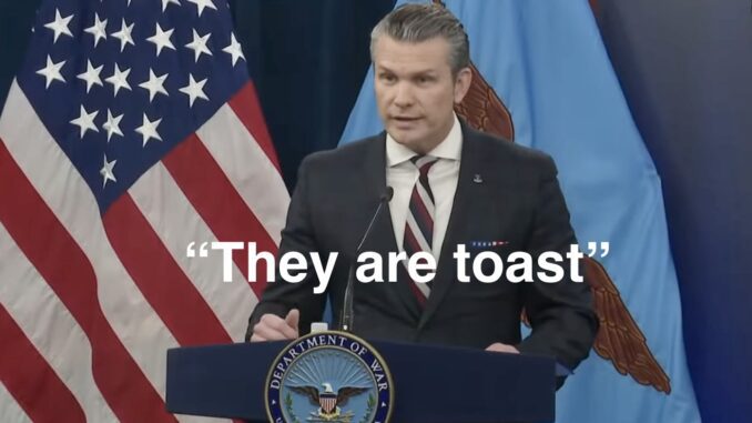 Speaker in suit before American flag, captioned