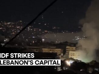 Nighttime cityscape with smoke and text overlay.