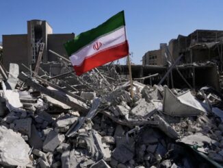 Iranian flag amidst building rubble and debris.