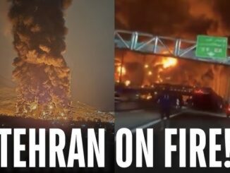 Tehran engulfed in large fire, night scene.