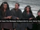 Four people sitting, text questioning contributions.