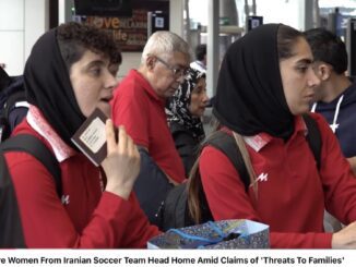 Iranian soccer team women at airport.