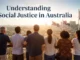 Group observing cityscape under Australian flags.