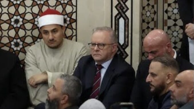 Group of men sitting in a mosque. Group of men sitting in a mosque.