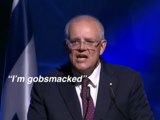Man speaking at podium, "I'm gobsmacked.
