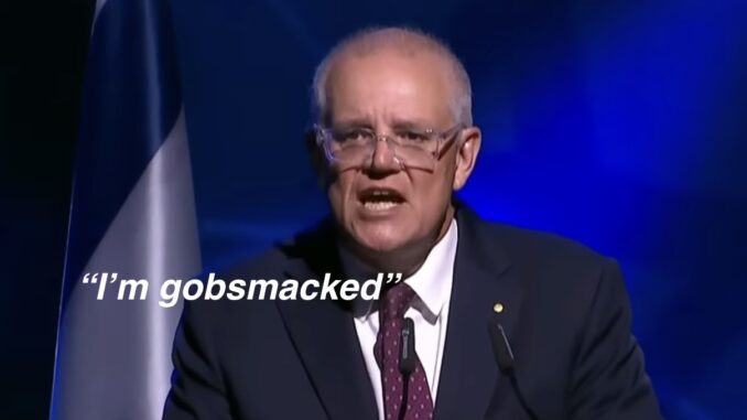 Man speaking at podium, "I'm gobsmacked. Man speaking at podium, "I'm gobsmacked.