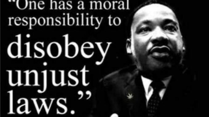 Man with quote on moral responsibility. Man with quote on moral responsibility.