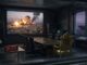 Command center with explosion on screen.