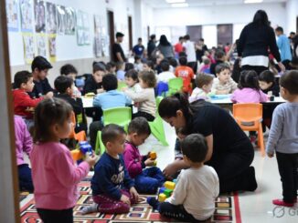Children playing and learning in a classroom.