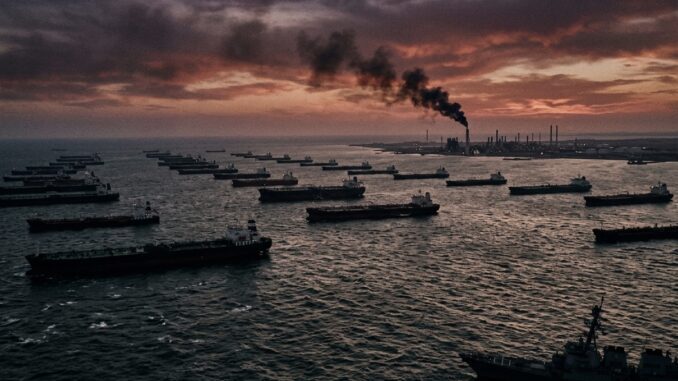 Ships at sea with industrial smoke background.