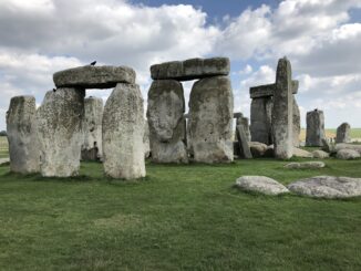 Stonehenge under a partly cloudy sky.