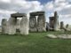 Stonehenge under a partly cloudy sky.