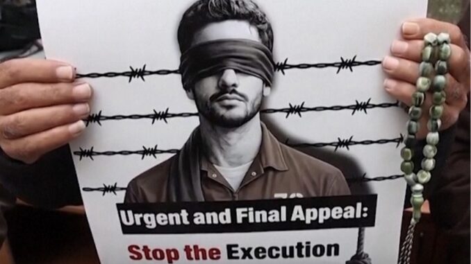 Protest sign against execution of prisoners law.