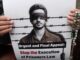 Protest sign against execution of prisoners law.