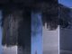 Twin Towers with heavy smoke, September 11 attacks.