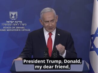Man speaking at podium with Israeli flag