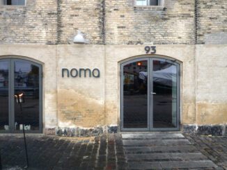 Noma restaurant entrance on cobblestone pavement