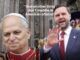 Man in suit waving beside cleric