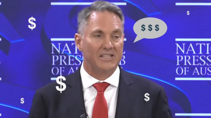 Man speaking at press club with dollar symbols Man speaking at press club with dollar symbols