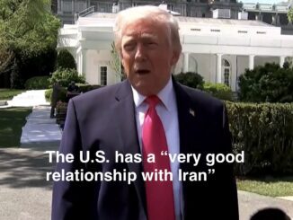Man in suit, red tie, White House caption