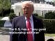 Man in suit, red tie, White House caption