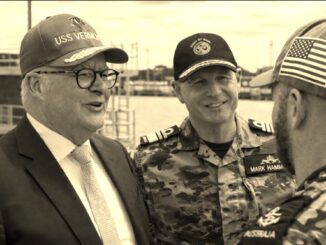 Three smiling naval officers conversing at dock