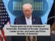 Person speaking at White House podium