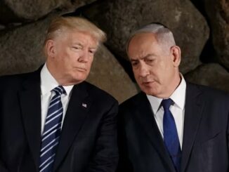 Two men in suits conversing against stone wall