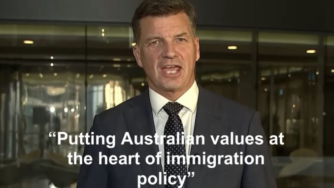Man in suit speaking with immigration quote