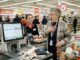 Elderly woman surprised at grocery checkout
