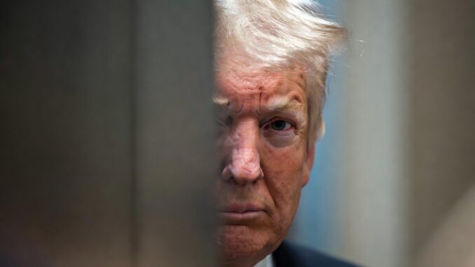 Man with white hair peering through narrow gap Man with white hair peering through narrow gap