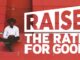 Person sitting near "Raise the Rate" sign