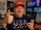 Smiling man wearing MAGA hat and USA shirt