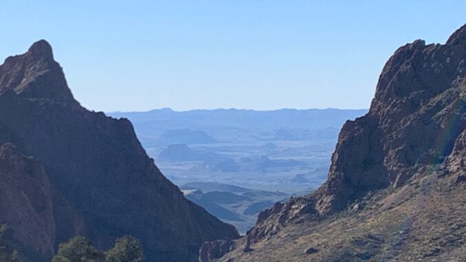Desert mountain canyon with distant blue ridges Desert mountain canyon with distant blue ridges