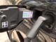 Electric car charging plug connected to vehicle