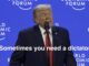 Speaker at economic forum with quoted caption