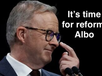 Man in glasses touching nose, reform text