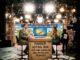Television studio debate with satirical voting box