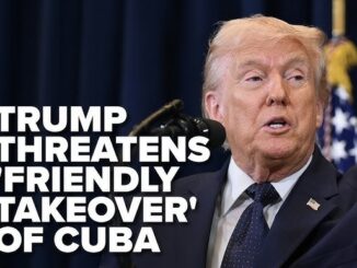 Politician at podium with Cuba takeover headline
