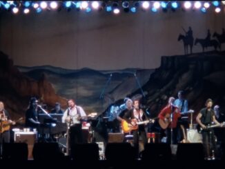 Live band performing on stage with guitars