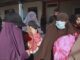 Women in burqas and face masks