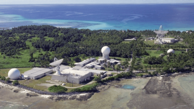 Coastal satellite tracking facility with white radomes Coastal satellite tracking facility with white radomes