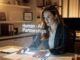 Businesswoman interacting with holographic AI interface