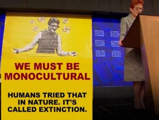 Speaker beside yellow "We must be monocultural" poster