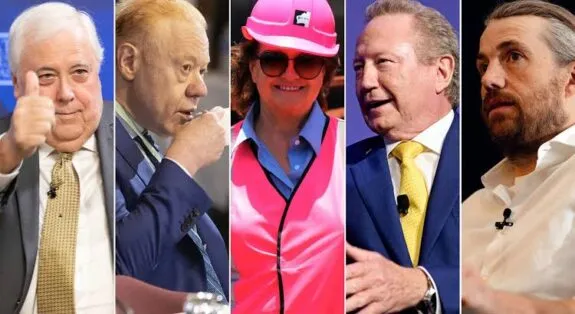 Five people in suits and a pink hardhat