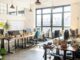 Bright open-plan office with desks and plants