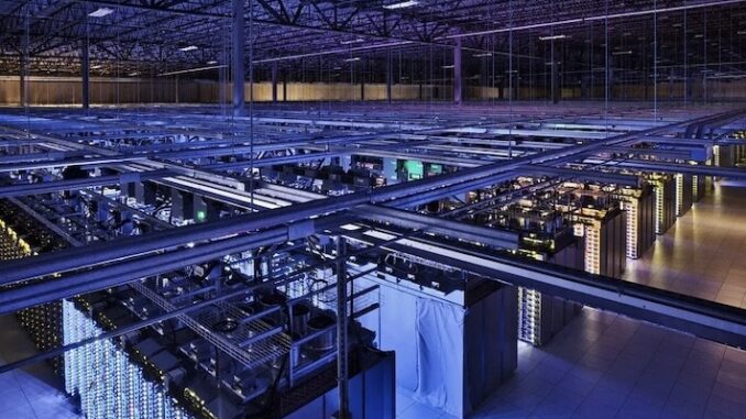 Large blue lit data center with server racks Large blue lit data center with server racks