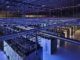 Large blue lit data center with server racks