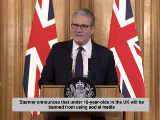 Speaker at podium with UK flags