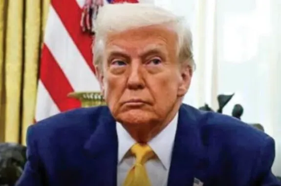 Man in suit with yellow tie in office